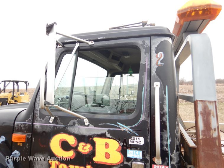 image for item EK9158 1999 International 4700 rollback tow truck