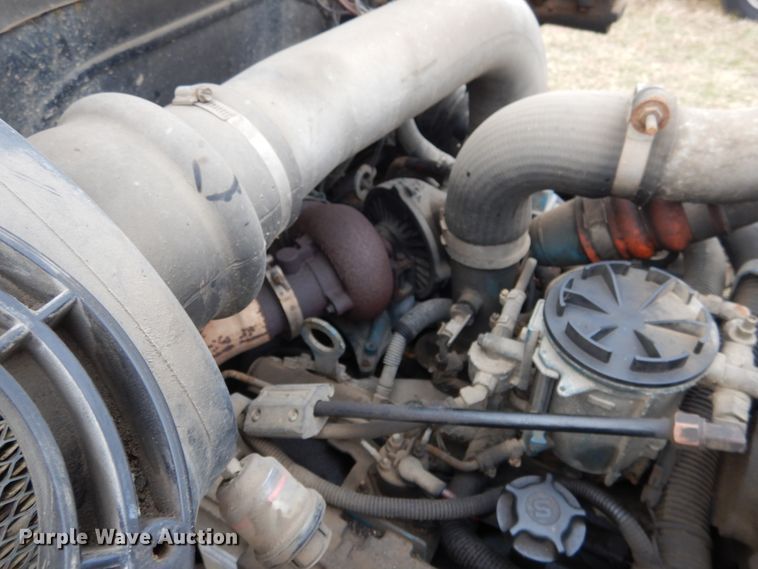 image for item EK9158 1999 International 4700 rollback tow truck