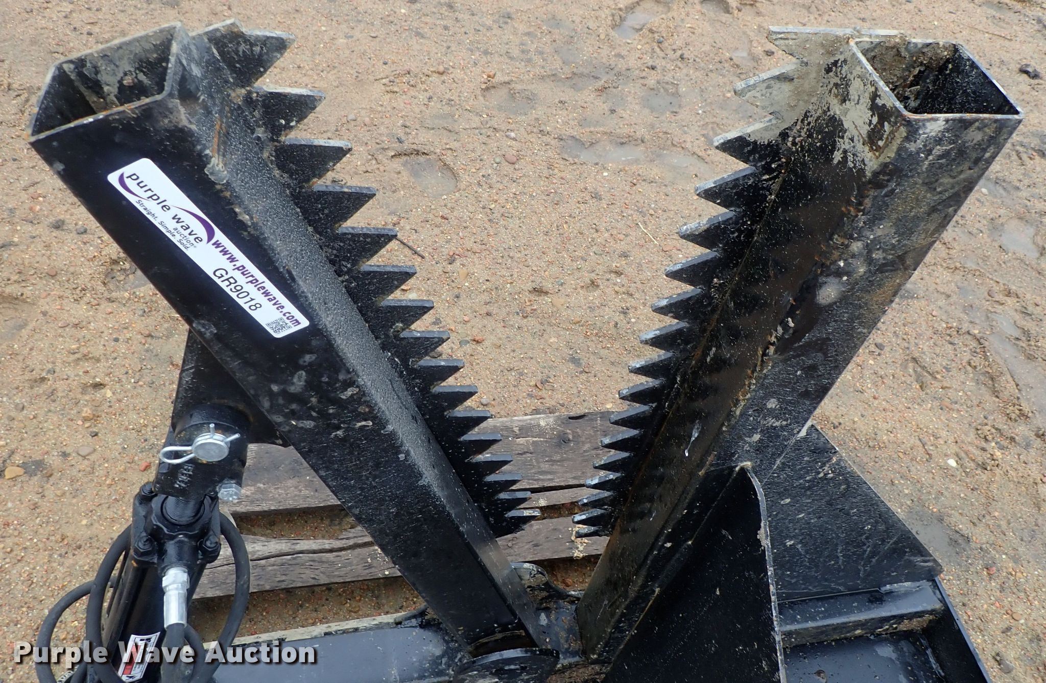 Skid steer tree cutter in Kinsley, KS Item GR9018 sold Purple Wave