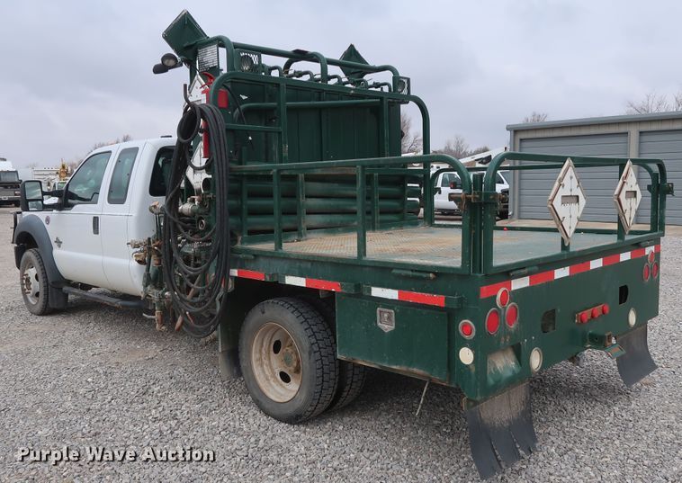 image for item GD9979 2012 Ford F550 Super Duty XL SuperCab flatbed treater truck
