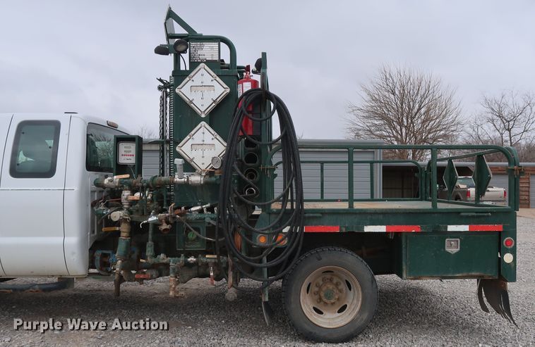 image for item GD9979 2012 Ford F550 Super Duty XL SuperCab flatbed treater truck