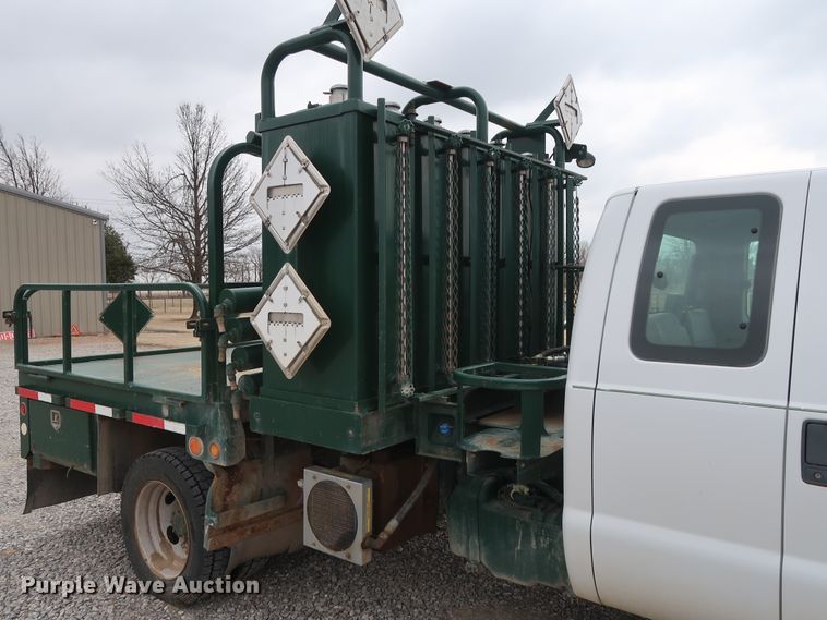 image for item GD9979 2012 Ford F550 Super Duty XL SuperCab flatbed treater truck