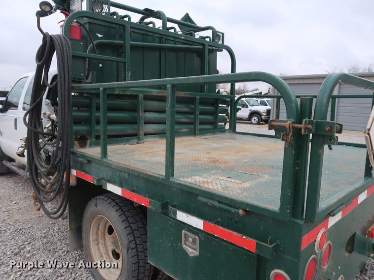 image for item GD9979 2012 Ford F550 Super Duty XL SuperCab flatbed treater truck