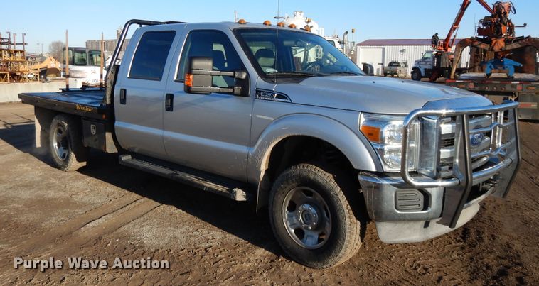 image for item DF5872 2011 Ford F350 Super Duty Crew Cab bale bed pickup truck