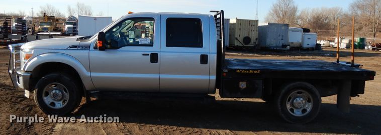 image for item DF5872 2011 Ford F350 Super Duty Crew Cab bale bed pickup truck