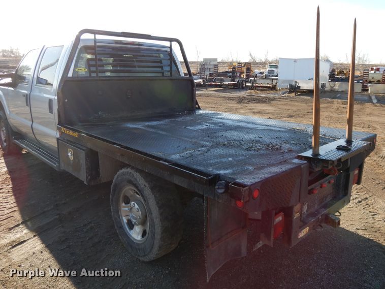 image for item DF5872 2011 Ford F350 Super Duty Crew Cab bale bed pickup truck