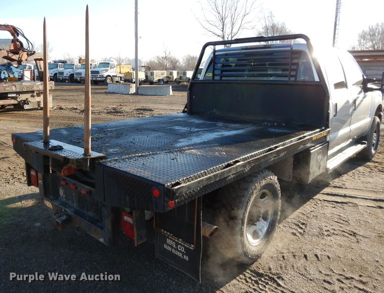 image for item DF5872 2011 Ford F350 Super Duty Crew Cab bale bed pickup truck