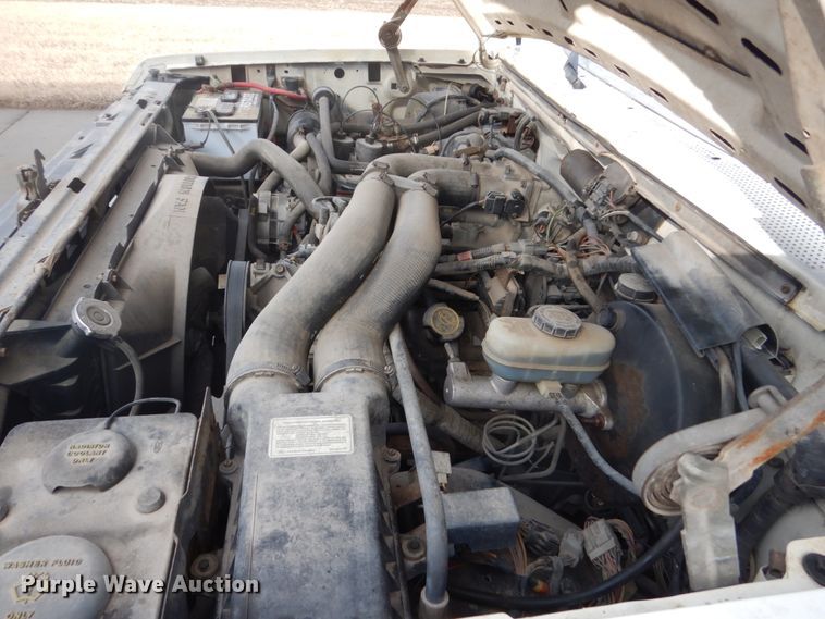 image for item GW9524 1988 Ford F350 utility bed pickup truck with crane