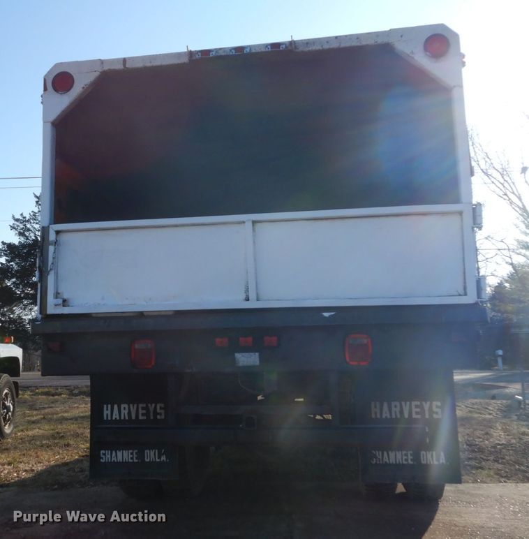 image for item GB9790 1999 GMC C6500 chip bed truck