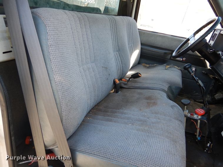 image for item GB9790 1999 GMC C6500 chip bed truck