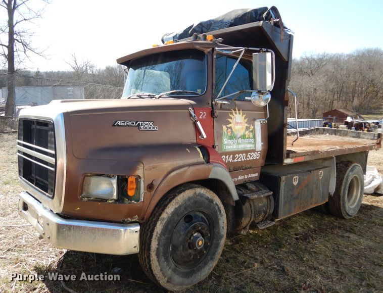 image for item GB9795 1990 Ford L9000 flat dump bed truck