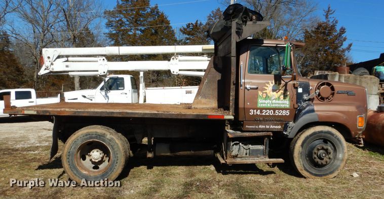 image for item GB9795 1990 Ford L9000 flat dump bed truck