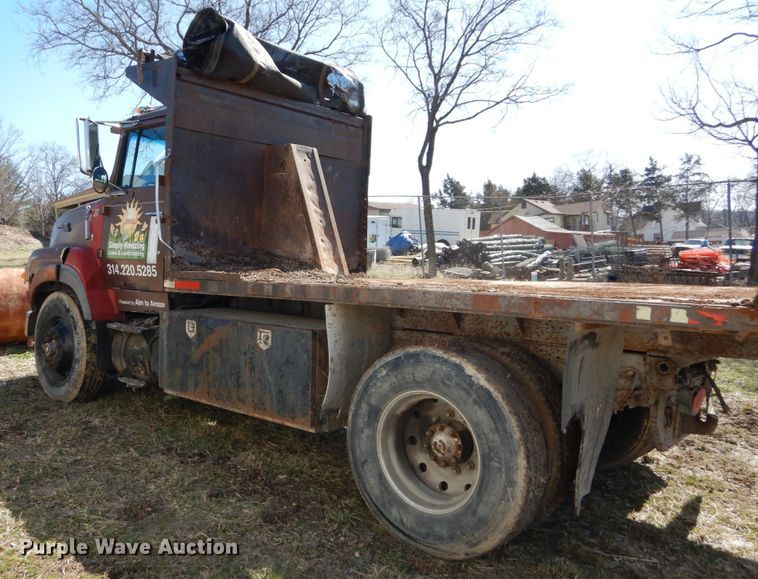 image for item GB9795 1990 Ford L9000 flat dump bed truck