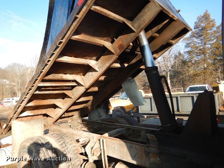 image for item GB9795 1990 Ford L9000 flat dump bed truck