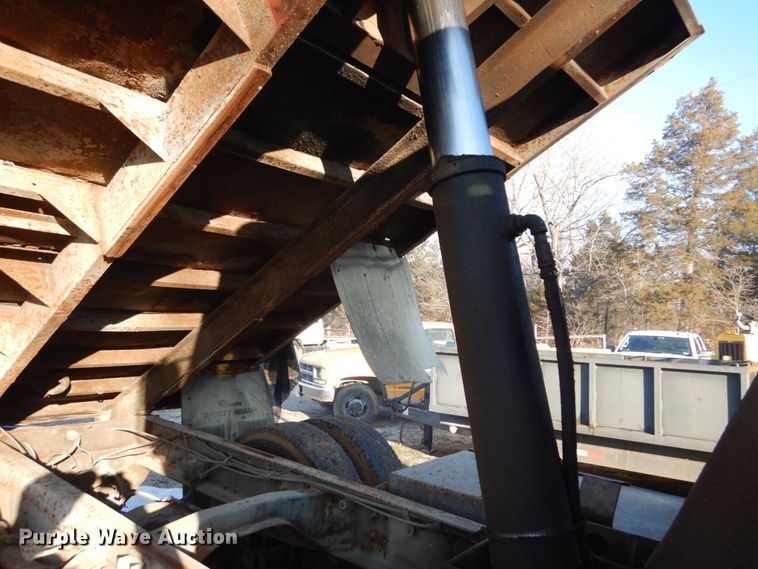 image for item GB9795 1990 Ford L9000 flat dump bed truck