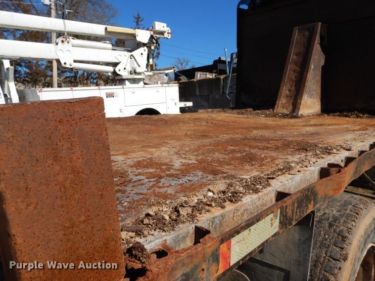 image for item GB9795 1990 Ford L9000 flat dump bed truck