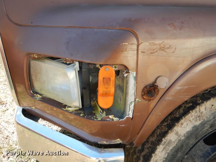 image for item GB9795 1990 Ford L9000 flat dump bed truck