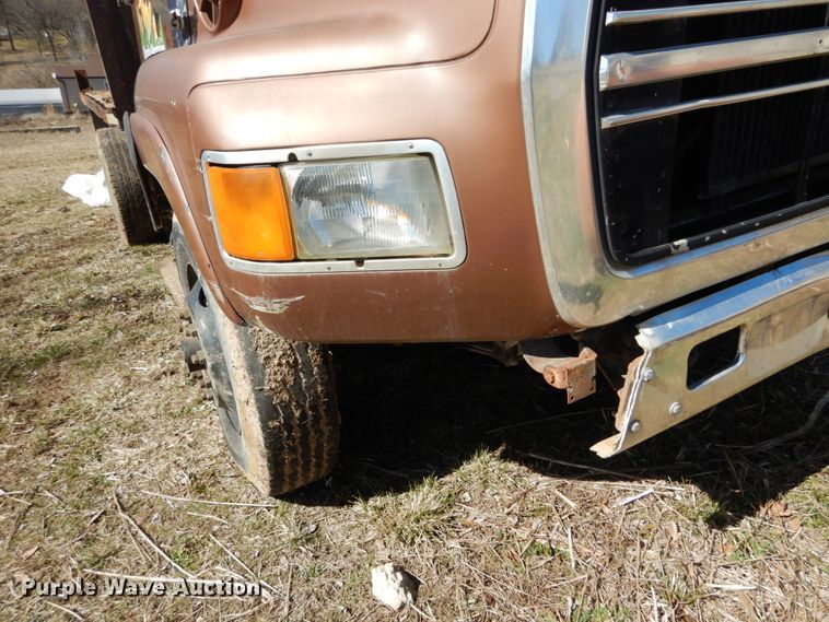 image for item GB9795 1990 Ford L9000 flat dump bed truck