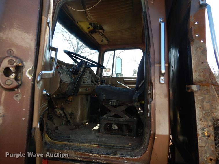 image for item GB9795 1990 Ford L9000 flat dump bed truck