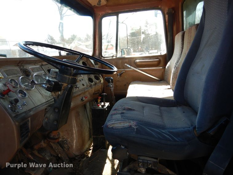 image for item GB9795 1990 Ford L9000 flat dump bed truck