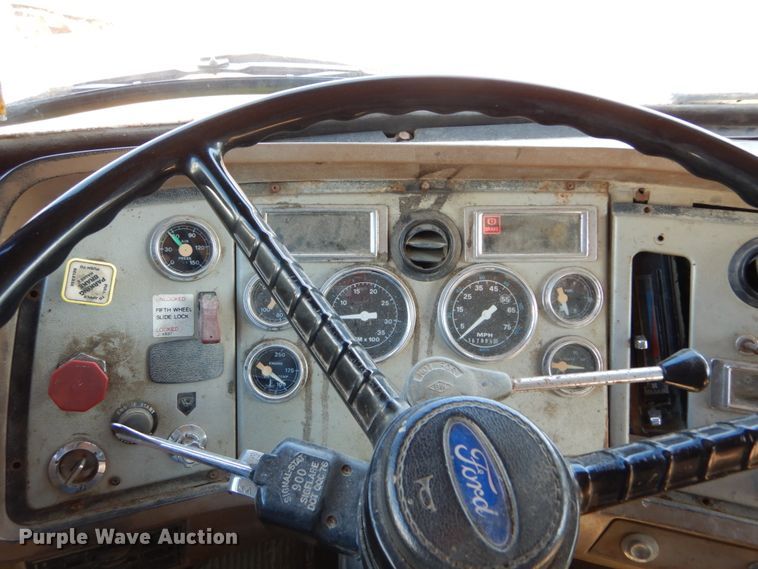 image for item GB9795 1990 Ford L9000 flat dump bed truck