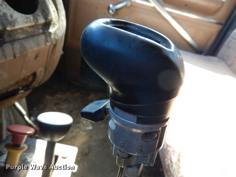 image for item GB9795 1990 Ford L9000 flat dump bed truck