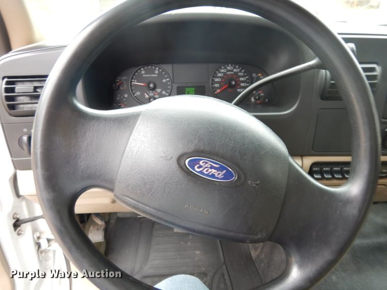 image for item DG6357 2006 Ford F450 Super Duty XL Crew Cab flatbed truck