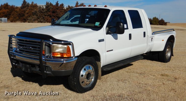 image for item DF7376 1999 Ford F450 Super Duty XLT Crew Cab flatbed truck