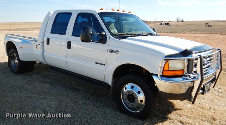 image for item DF7376 1999 Ford F450 Super Duty XLT Crew Cab flatbed truck