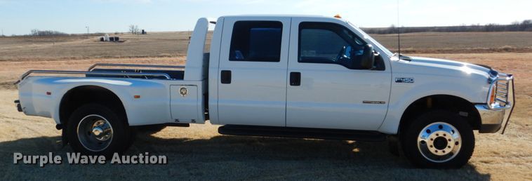 image for item DF7376 1999 Ford F450 Super Duty XLT Crew Cab flatbed truck