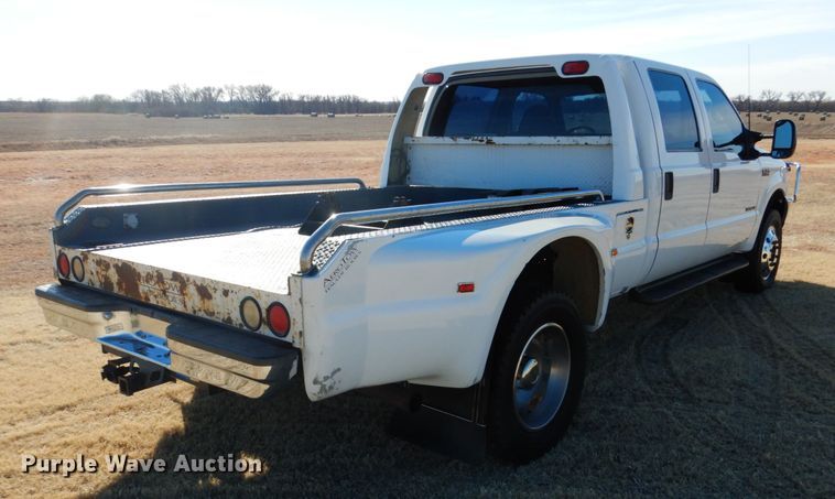 image for item DF7376 1999 Ford F450 Super Duty XLT Crew Cab flatbed truck