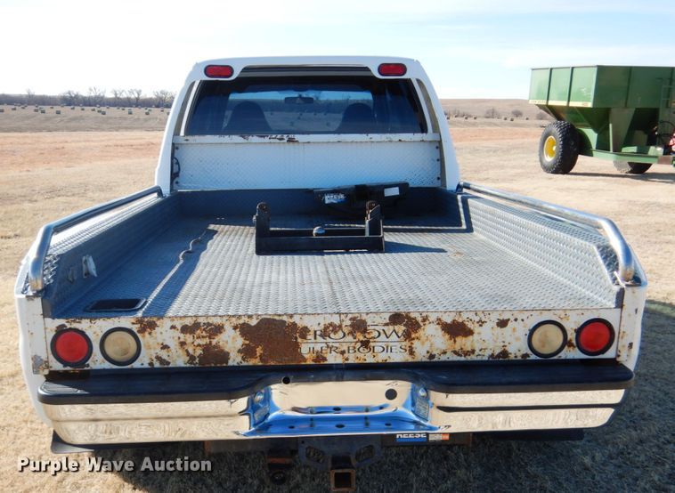 image for item DF7376 1999 Ford F450 Super Duty XLT Crew Cab flatbed truck