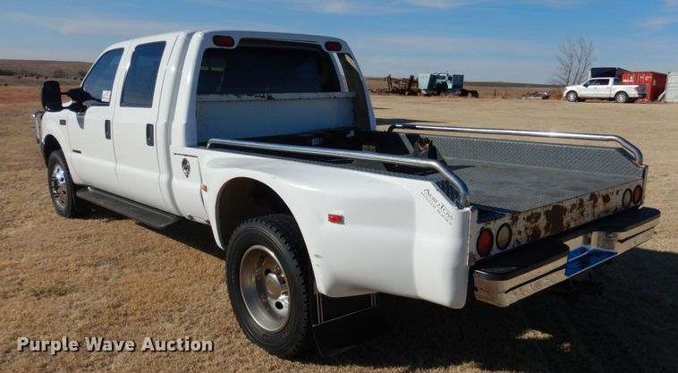 image for item DF7376 1999 Ford F450 Super Duty XLT Crew Cab flatbed truck