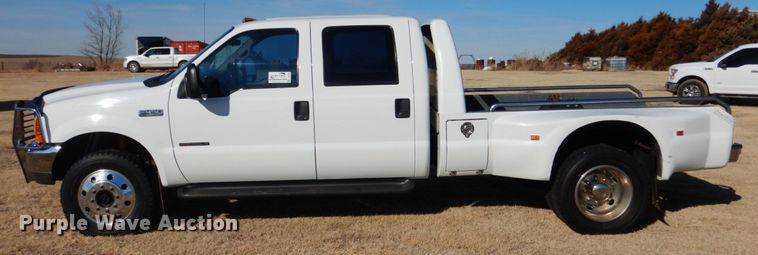 image for item DF7376 1999 Ford F450 Super Duty XLT Crew Cab flatbed truck