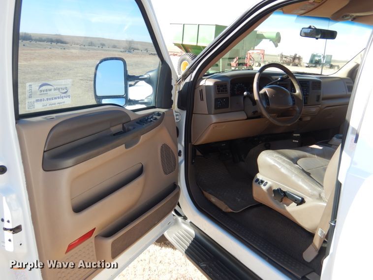 image for item DF7376 1999 Ford F450 Super Duty XLT Crew Cab flatbed truck