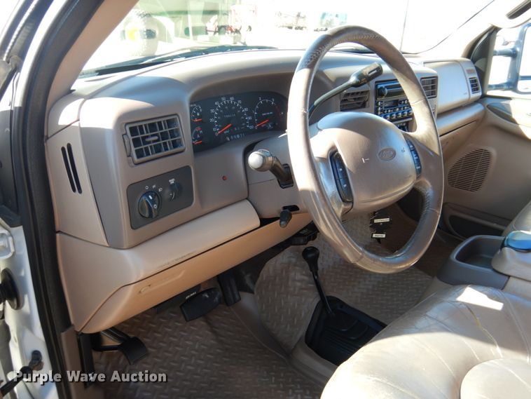 image for item DF7376 1999 Ford F450 Super Duty XLT Crew Cab flatbed truck