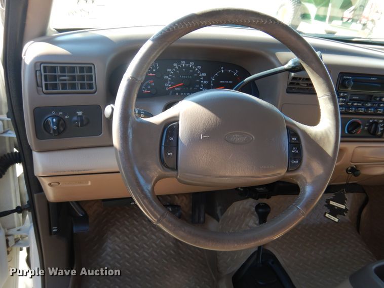 image for item DF7376 1999 Ford F450 Super Duty XLT Crew Cab flatbed truck