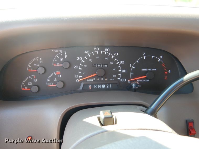 image for item DF7376 1999 Ford F450 Super Duty XLT Crew Cab flatbed truck