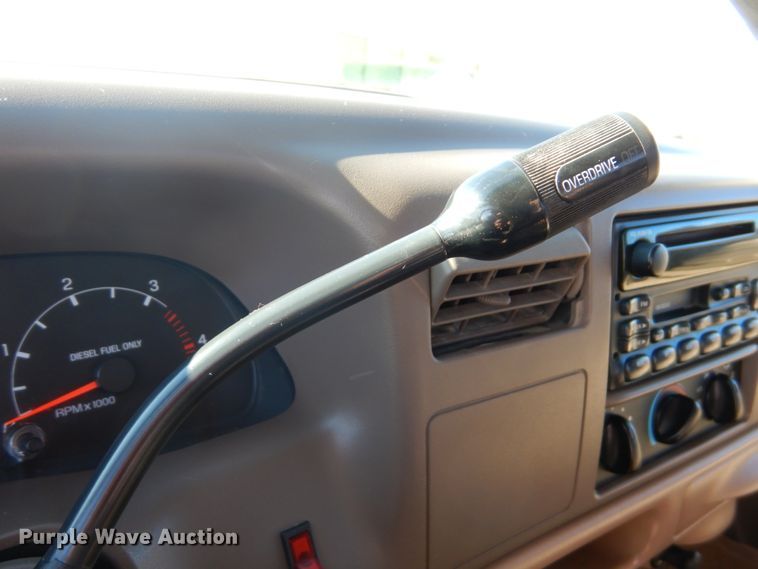 image for item DF7376 1999 Ford F450 Super Duty XLT Crew Cab flatbed truck