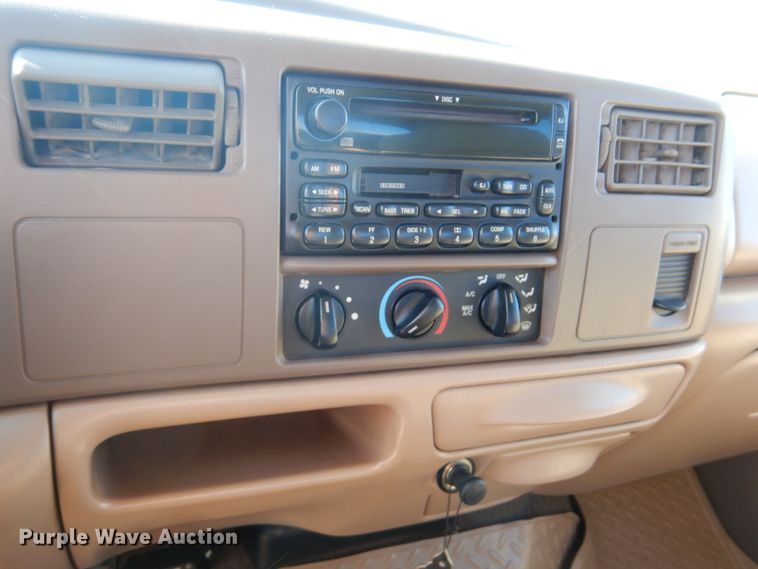 image for item DF7376 1999 Ford F450 Super Duty XLT Crew Cab flatbed truck