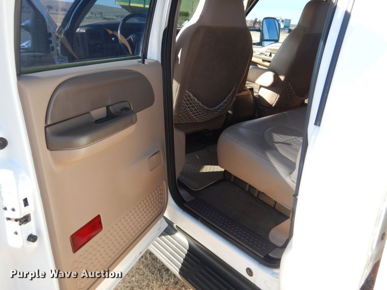 image for item DF7376 1999 Ford F450 Super Duty XLT Crew Cab flatbed truck