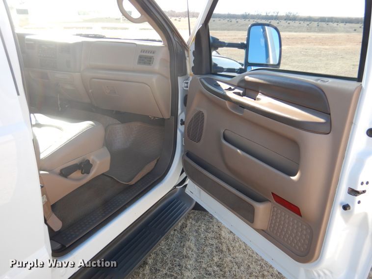 image for item DF7376 1999 Ford F450 Super Duty XLT Crew Cab flatbed truck