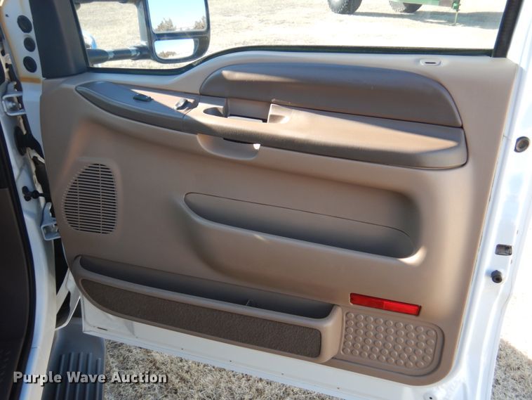 image for item DF7376 1999 Ford F450 Super Duty XLT Crew Cab flatbed truck