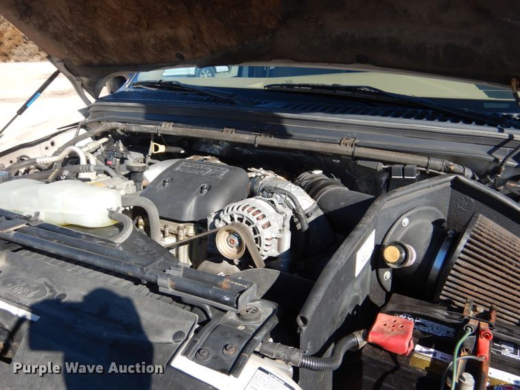 image for item DF7376 1999 Ford F450 Super Duty XLT Crew Cab flatbed truck