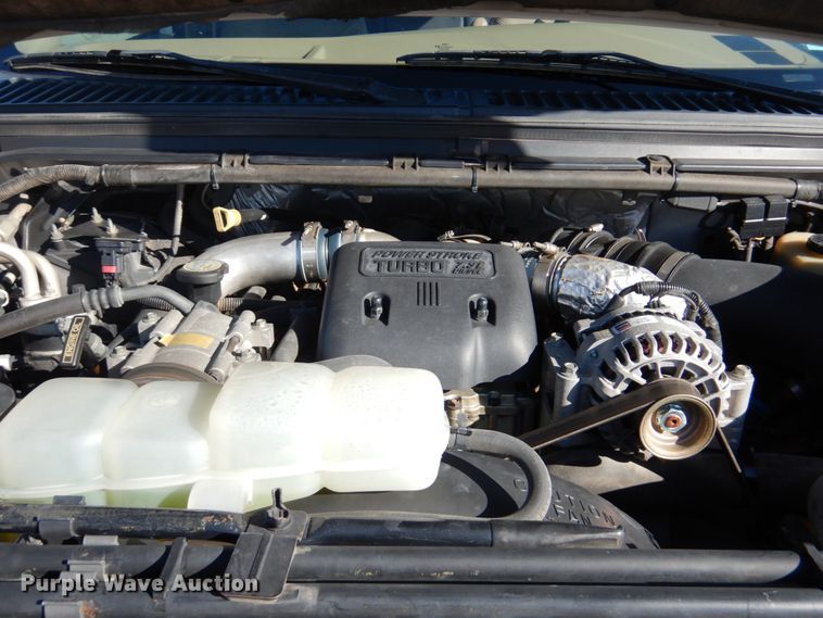 image for item DF7376 1999 Ford F450 Super Duty XLT Crew Cab flatbed truck