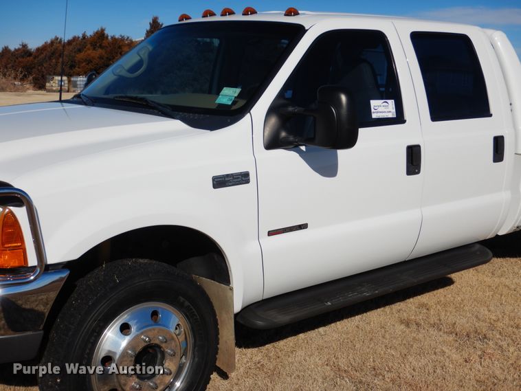 image for item DF7376 1999 Ford F450 Super Duty XLT Crew Cab flatbed truck