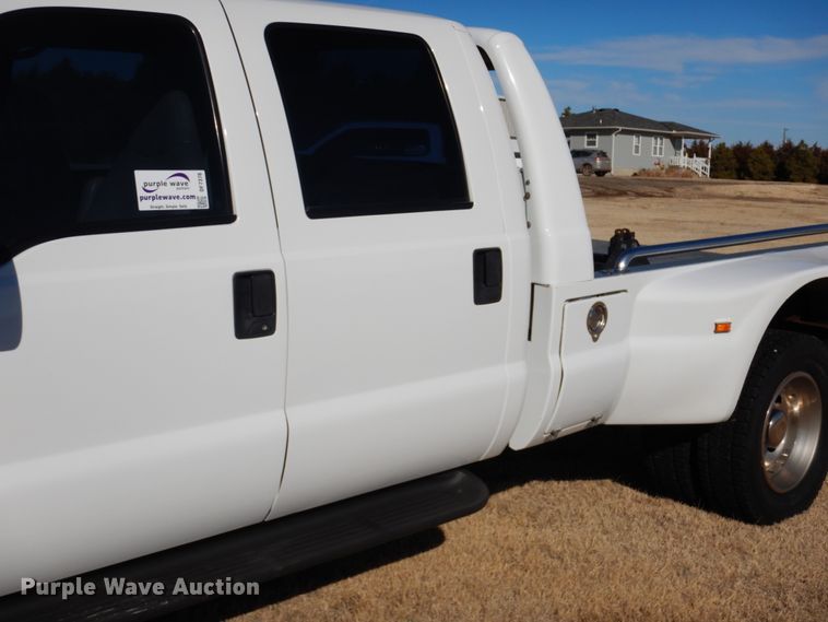 image for item DF7376 1999 Ford F450 Super Duty XLT Crew Cab flatbed truck