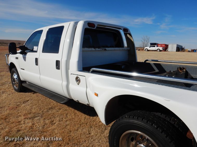 image for item DF7376 1999 Ford F450 Super Duty XLT Crew Cab flatbed truck