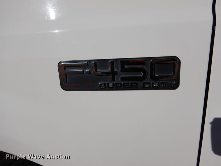 image for item DF7376 1999 Ford F450 Super Duty XLT Crew Cab flatbed truck