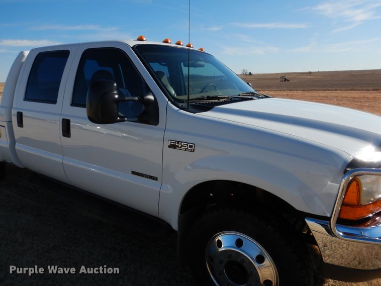 image for item DF7376 1999 Ford F450 Super Duty XLT Crew Cab flatbed truck